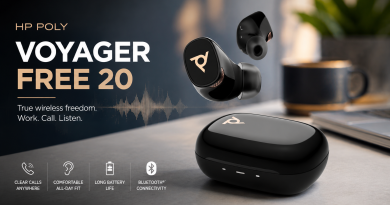 Black HP Poly Voyager Free 20 wireless earbuds and charging case displayed on a modern desk.